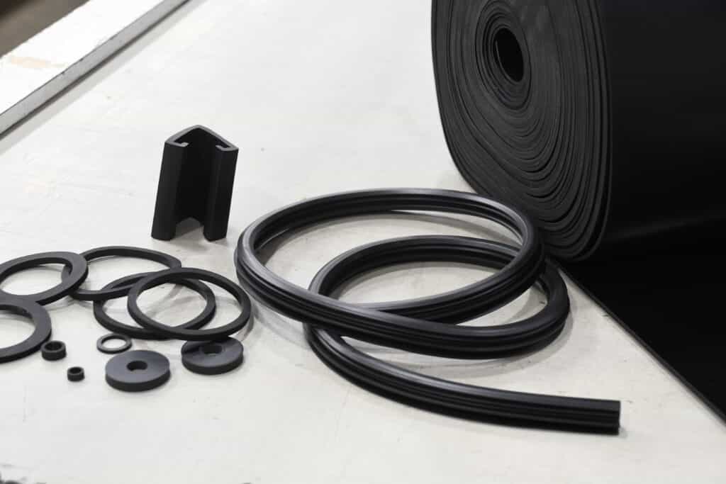 black rubber pieces - roll, extrusions, washers, etc.