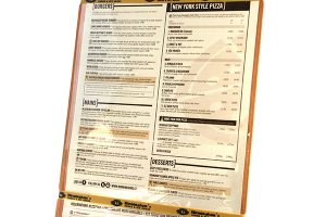 Beige menu for Birmingham's restaurant. The menu is laminated and bound to a wooden board by one silicone band at the top of the menu and another silicone band at the bottom of the menu. The silicone bands are gold and imprinted with the restaurant logo