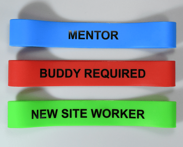 three hard hat bands, blue, red, green, "mentor, buddy required, new site worker"
