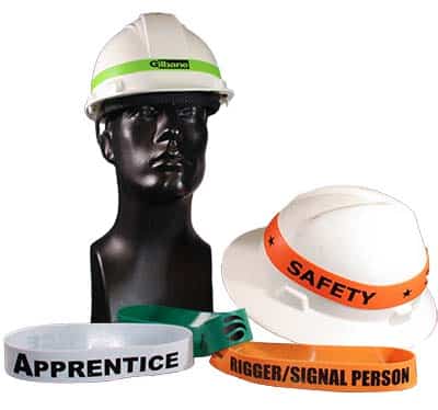 Mannequin head wearing hard hat surrounded by orange, white, and green hard hat bands